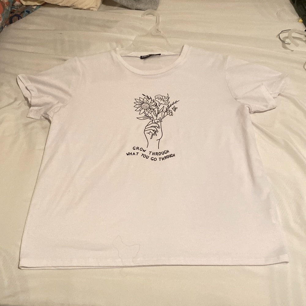 large white t shirt “grow through what you go through”